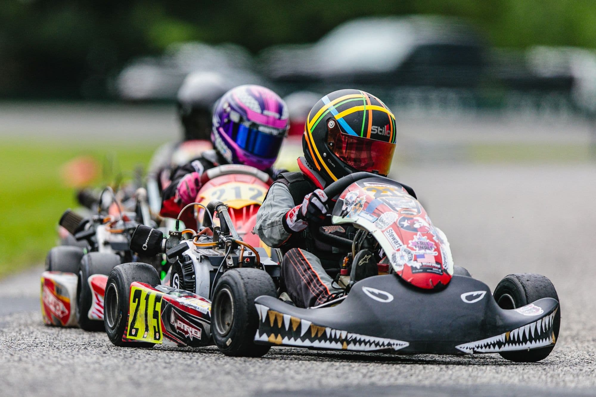 A tight pack of karts running nose to tail at GCKI Katy.