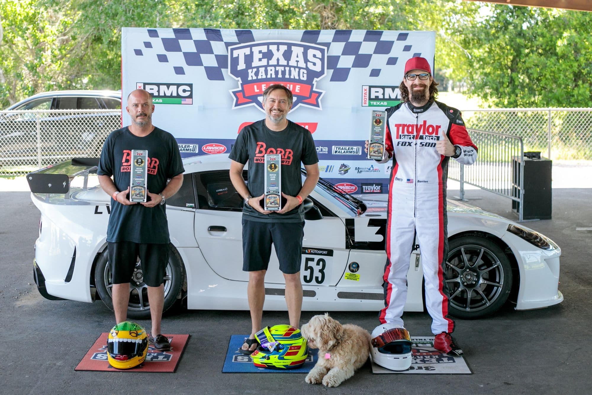Drivers and a dog on the GCKI Katy podium after the race.